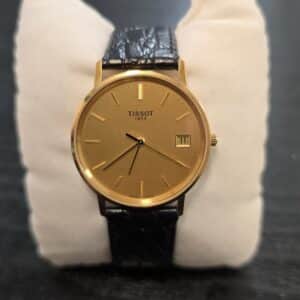 Tissot 1853 Gold Certificate 14K miesten rannekello kullanvärisellä taululla ja mustalla nahkarannekkeella