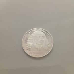 Ranskan 100 francs juhlaraha vuodelta 1991, jossa Descartesin muotokuva ja toisella puolella käsi ja lippu tähtien ympäröimänä